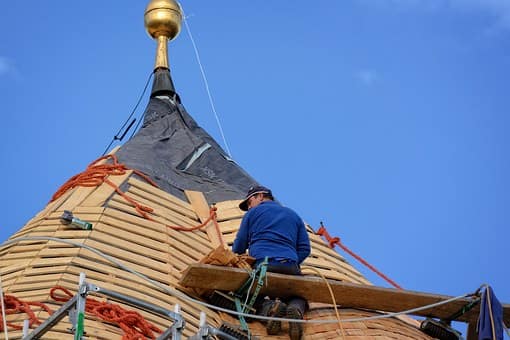 man installing roof